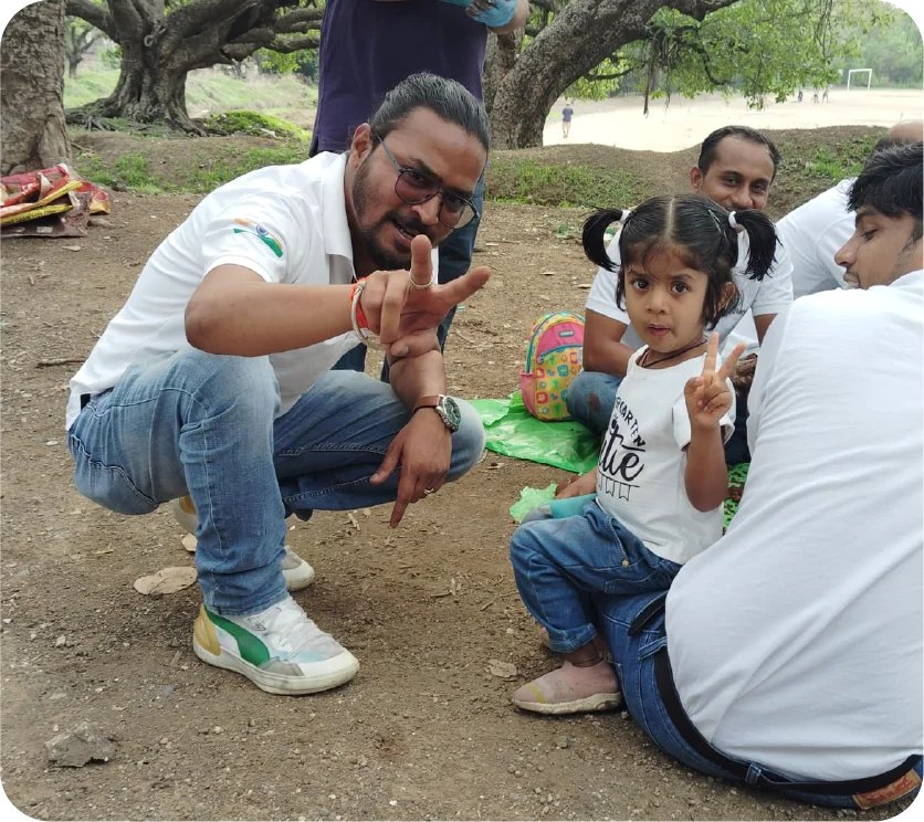 Volunteers posing together after completing seedball preparation